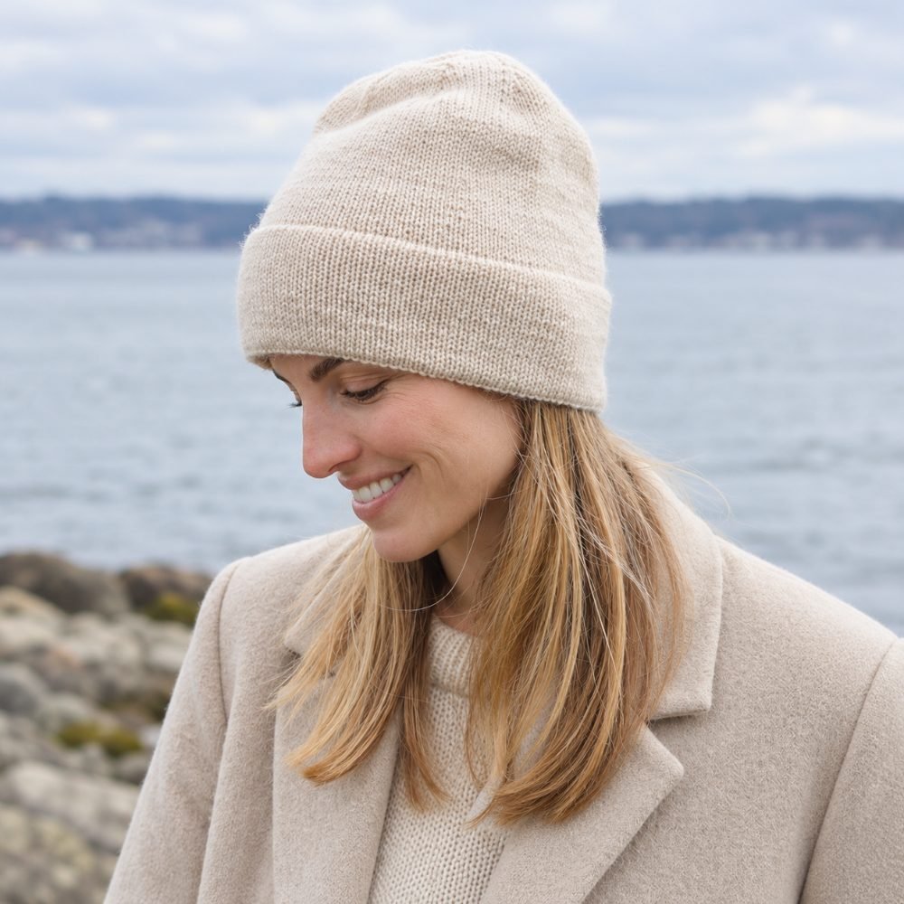 Wheat-colored stockinette knitted hat with a fold-up brim, DROPS Fall Air Hat